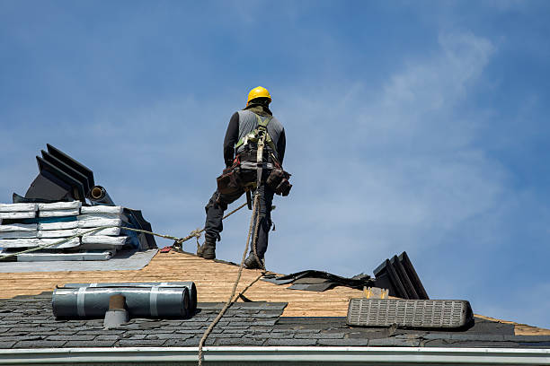 Professional Storm Damage Roof Repair technician working in Tecumseh, OK